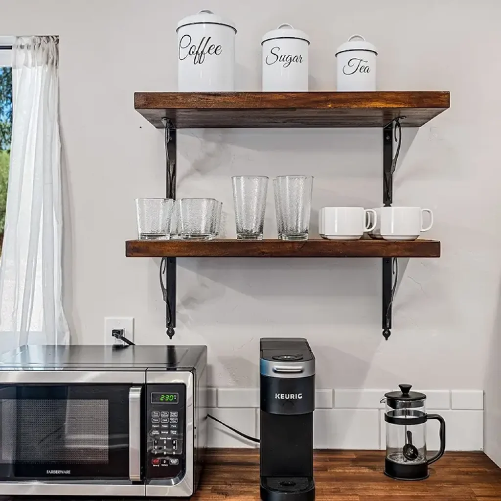 Kitchen microwave, coffee maker, french press, cups and silverware Tucson Vacation Rental
