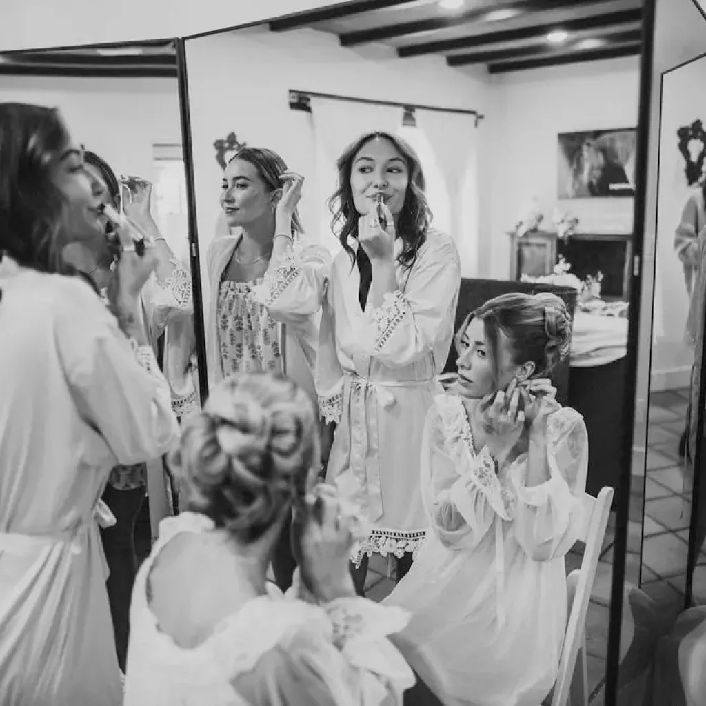black and white photo bride and bridesmaids getting ready bridal suite tucson wedding venue